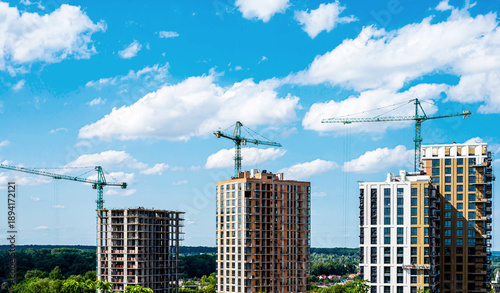 Wallpaper Mural Modern multi-storey new buildings of different colors on a background of blue sky with clouds Torontodigital.ca