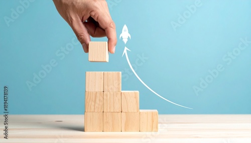 Hand Building a Wooden Block Staircase with Rocket Icon and Upward Growth Arrow