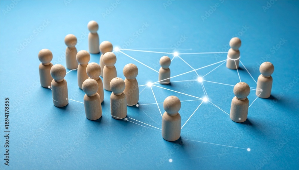 Obraz premium Network of Wooden Peg Dolls on a Blue Background Representing Human Connectivity and Social Graphs