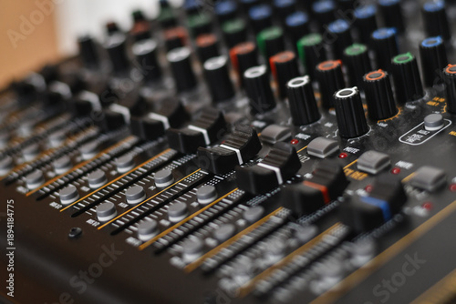 Buttons of professsional music audio sound mixer. Low DOF, selective focus.