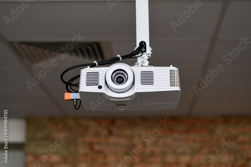 Ceiling Mounted Digital Projector in Modern Office or Conference Room
