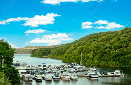 Wallpaper Mural Yacht club for light boats in a tributary of the river against a blue sky with clouds Torontodigital.ca