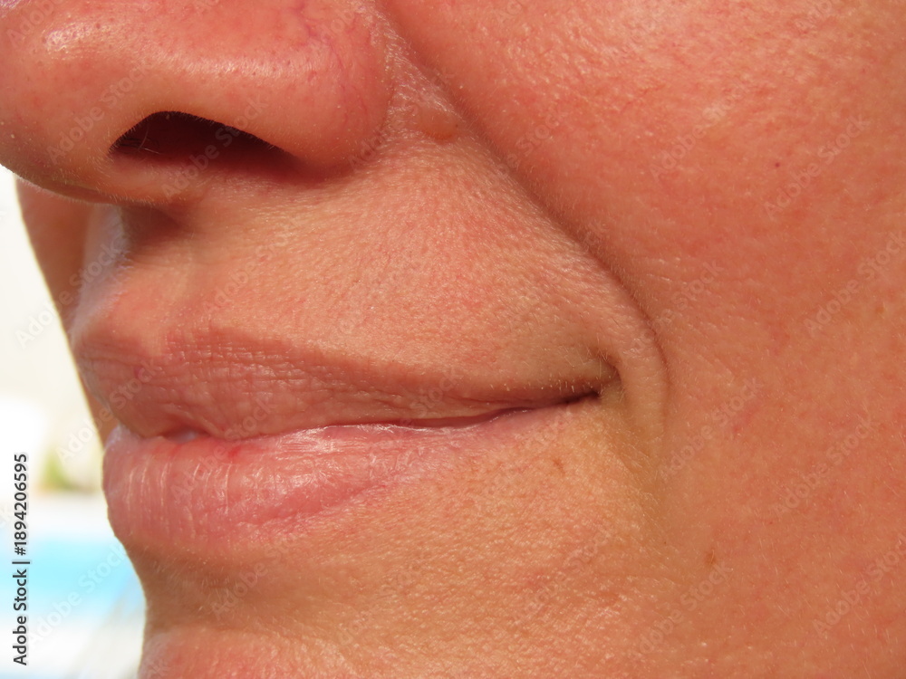 Obraz premium Closeup of a smiling woman face. Woman in her forties face.