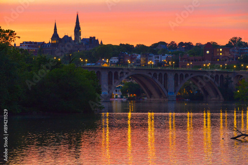 Картината върху платно Sunset over the Potomac river, Georgetown, Georgetown University, Key Bridge and The Potomac River Boathouse in Washington, D