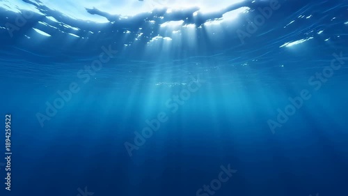 Underwater scene with sunlight rays penetrating the ocean surface, creating a serene and tranquil atmosphere. Ideal for relaxation and nature-themed projects