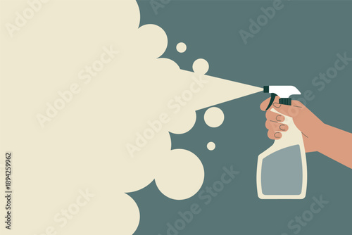 Hand spraying cleaning or sanitizing solution from a bottle, disinfection concept with copy space
