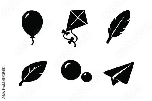Floating Icons Collection. Solid vector icons of floating elements: balloon, kite, feather, leaf, bubble, paper plane No text, No