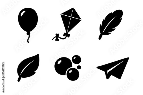 Floating Icons Collection. Solid vector icons of floating elements: balloon, kite, feather, leaf, bubble, paper plane No text, No