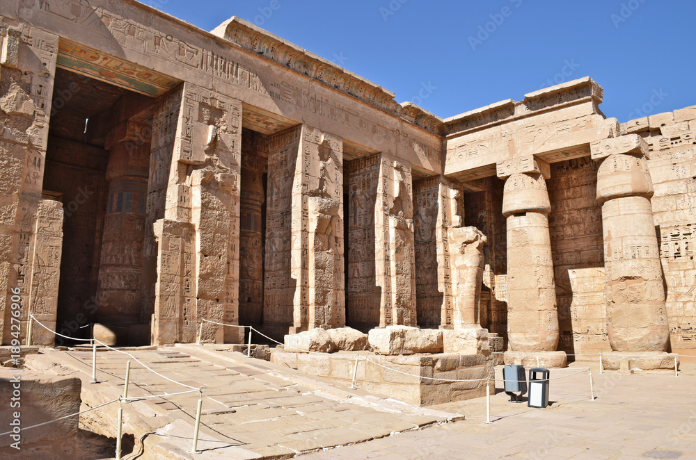 Fototapeta premium The Mortuary Temple of Hatshepsut in Deir el-Bahari, Egypt, with statues lining the grand colonnade.
