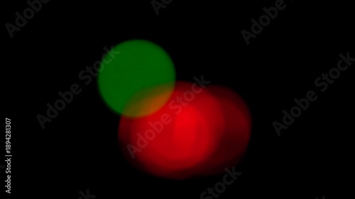 Abstract Red and Green Glowing Shapes Moving on Black Background, Blurred Light Motion