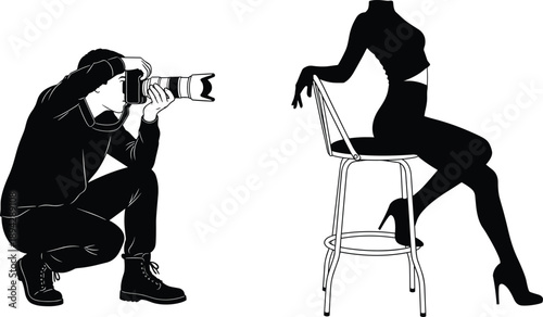 Professional Male Photographer Crouching While Capturing Silhouette of Elegant Female Model Posing on High Chair in Minimalist Black and White Studio