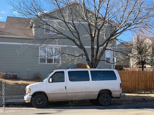 Work Van Parked Outside Home on Suburban Street