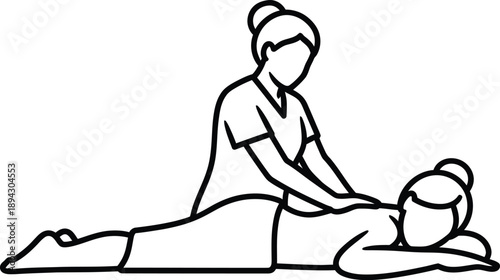 Massage therapist performing a back massage on a prone client