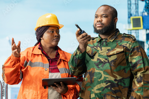 Photos Soldier on offshore rig deterring insurgent criminal attacks, speaking in walkie talkie