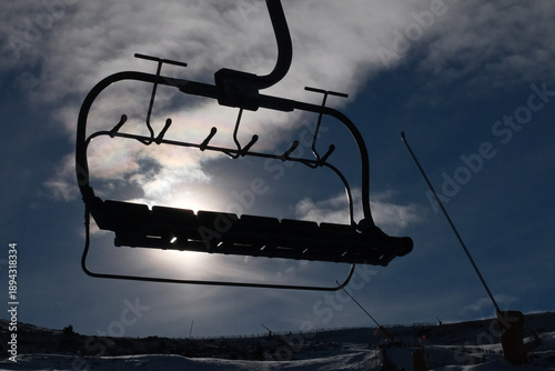 Skiers Going Down a Snowy Slope at Ski Resort in Winter
