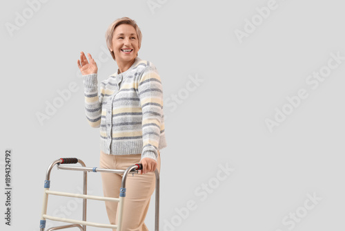 Mature woman with walker on...