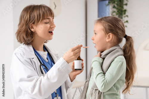 Sick little girl taking cou...