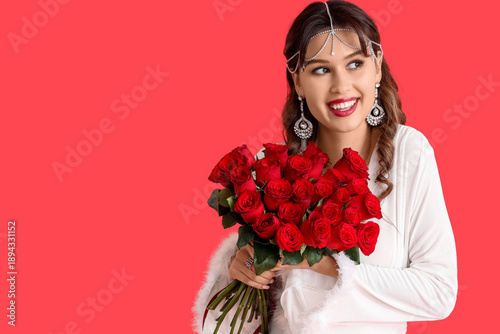 Happy young woman with bouq...