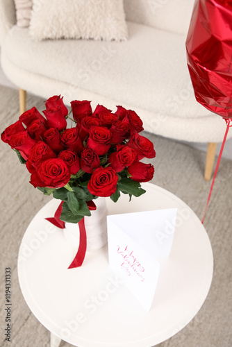 Vase with red rose flowers ...