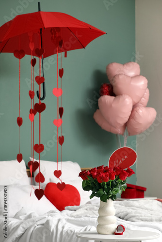 Vase with red roses and eng...
