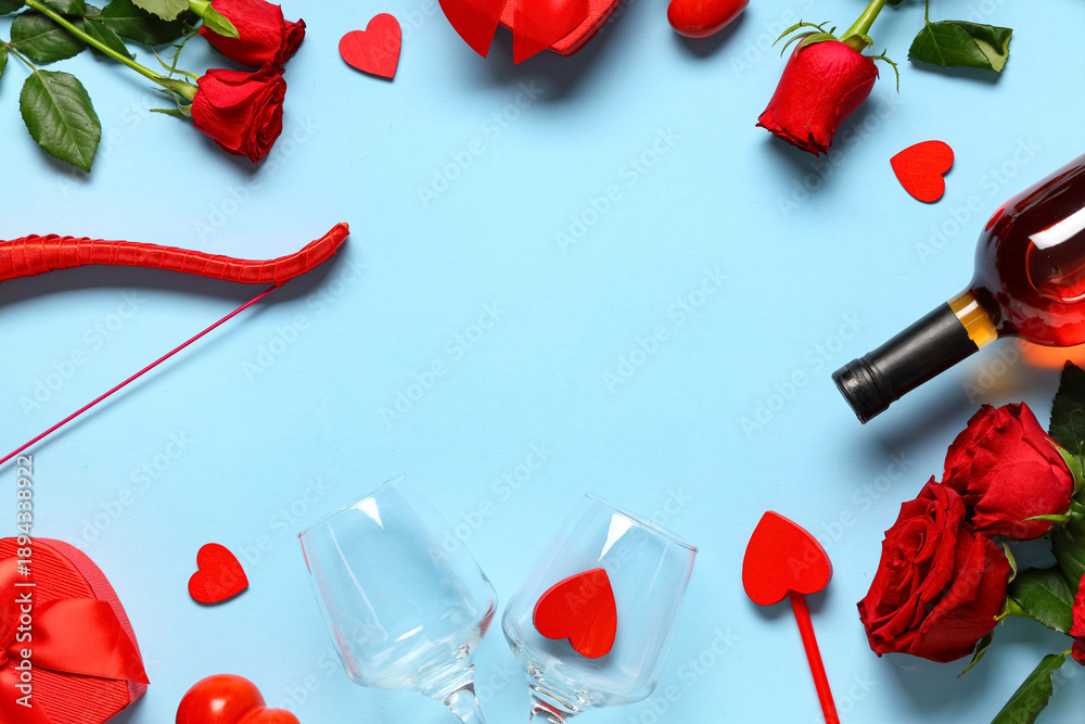 Naklejka premium Frame made of cupid's bow, arrow, bottle of wine and rose flowers on blue background. Valentine's Day celebration