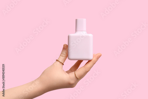 Female hand with bottle of ...
