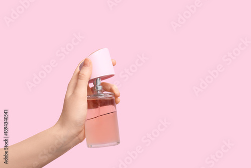 Female hand with bottle of ...