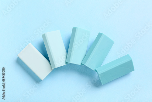 Blue rubber erasers on colo...
