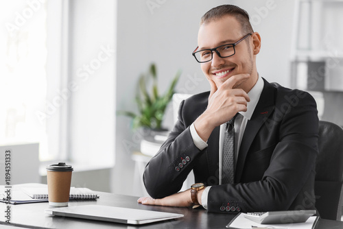 Handsome businessman with e...