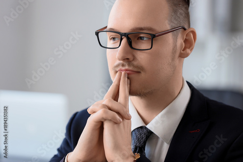 Thoughtful businessman in e...