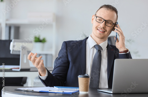 Handsome businessman with e...