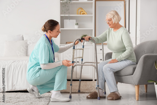 Nurse helping senior woman ...