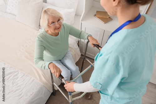 Nurse helping senior woman ...