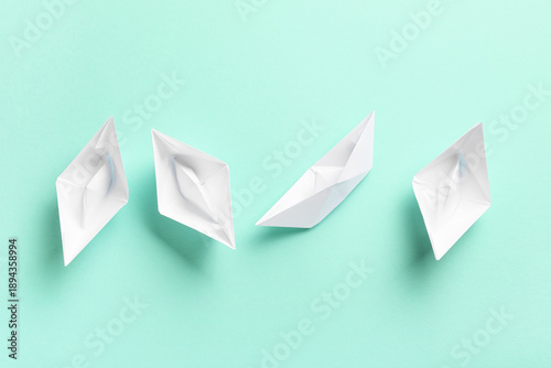 White paper boats on turquo...