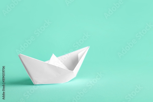 White paper boat on turquoi...