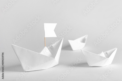 White paper boats with flag...
