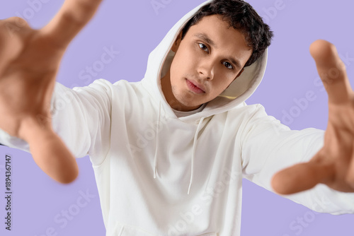 Young man in white hoodie o...