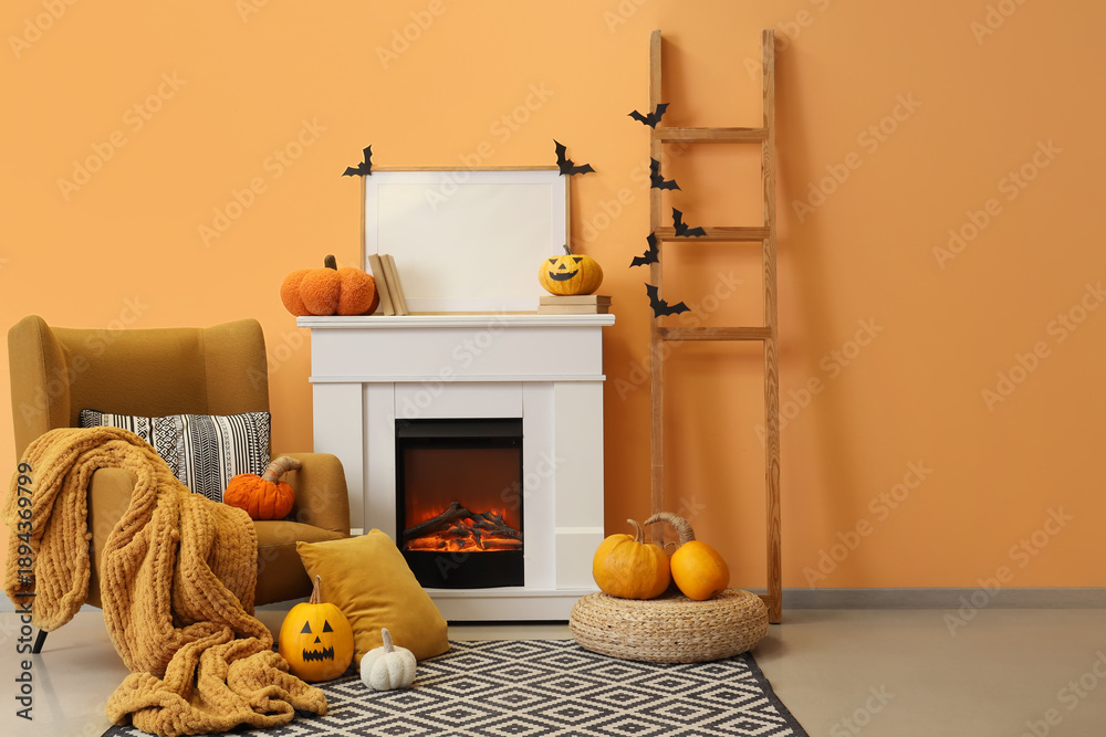 Obraz premium Interior of living room decorated for Halloween with fireplace, armchair and ladder