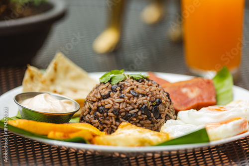 Obraz na plátně Gallo pinto breakfast plate with fried eggs and plantains