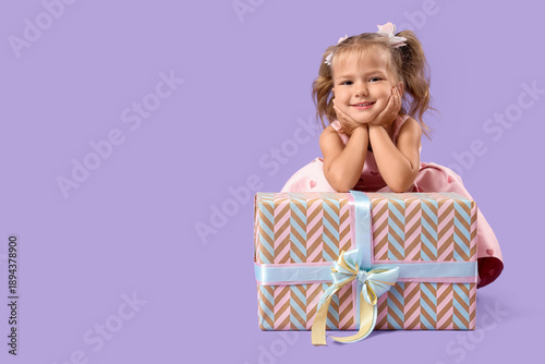 Cute little girl with gift ...