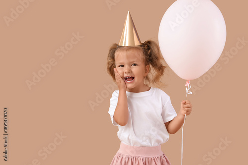 Cute little girl in party h...