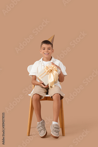 Cute little boy in party ha...