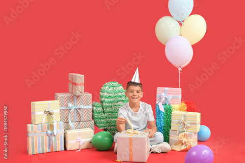 Cute little boy in party ha...