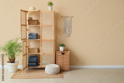 Open wooden closet with clo...