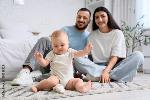 Happy young family and thei...