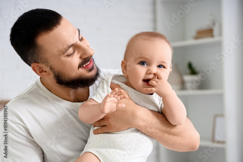 Happy young father with his...