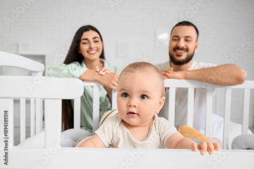 Happy young family and cute...