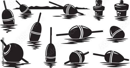 Black and white fishing bobbers floating on water surface