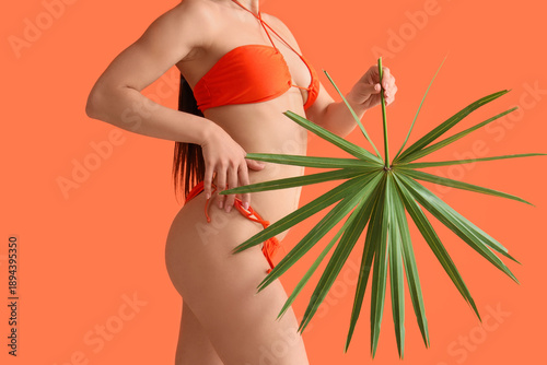 Young woman in swimsuit wit...