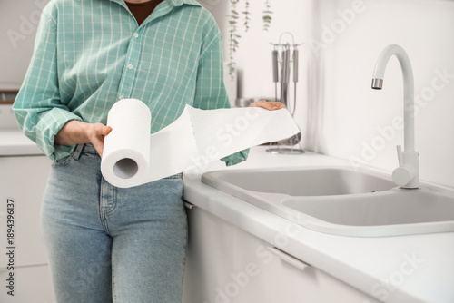 Young woman with roll of pa...